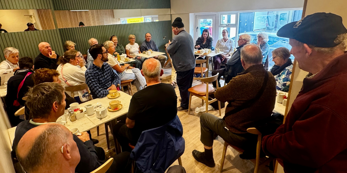 Sonny Egan holds the room at Tales over Teacups in Lynch's Bakery & Coffee Shop.
